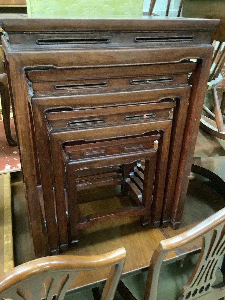 A Chinese nest of hardwood quartetto tables, largest 50cm